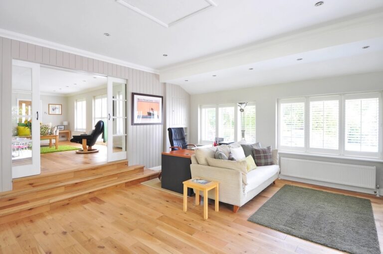 Bright, freshly cleaned living room with hardwood floors after a recurring house cleaning